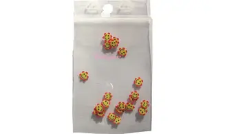 Sachet de fimo smiley fleur rouge