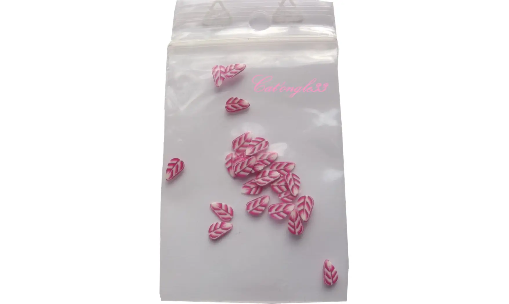 Sachet de fimo plume rose blanche
