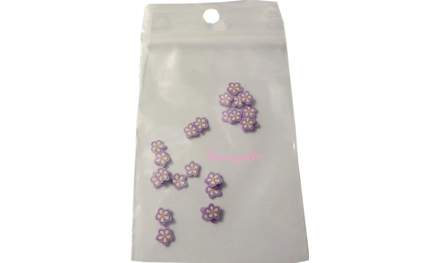 Sachet de fimo fleur parme blanche