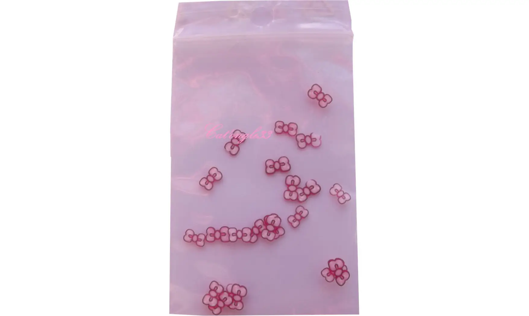 Sachet de fimo noeud fuchsia