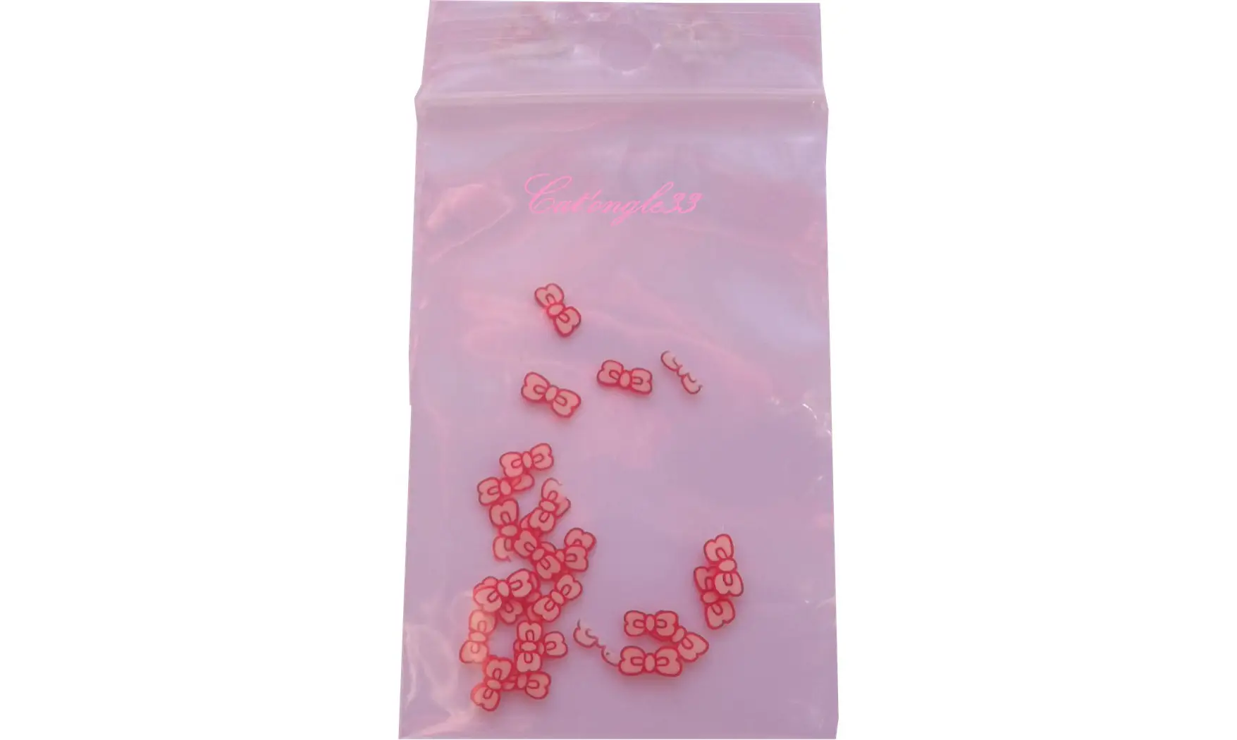 Sachet de fimo noeud rouge