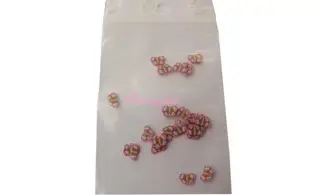 Sachet de fimo papillon rouge bleu vert