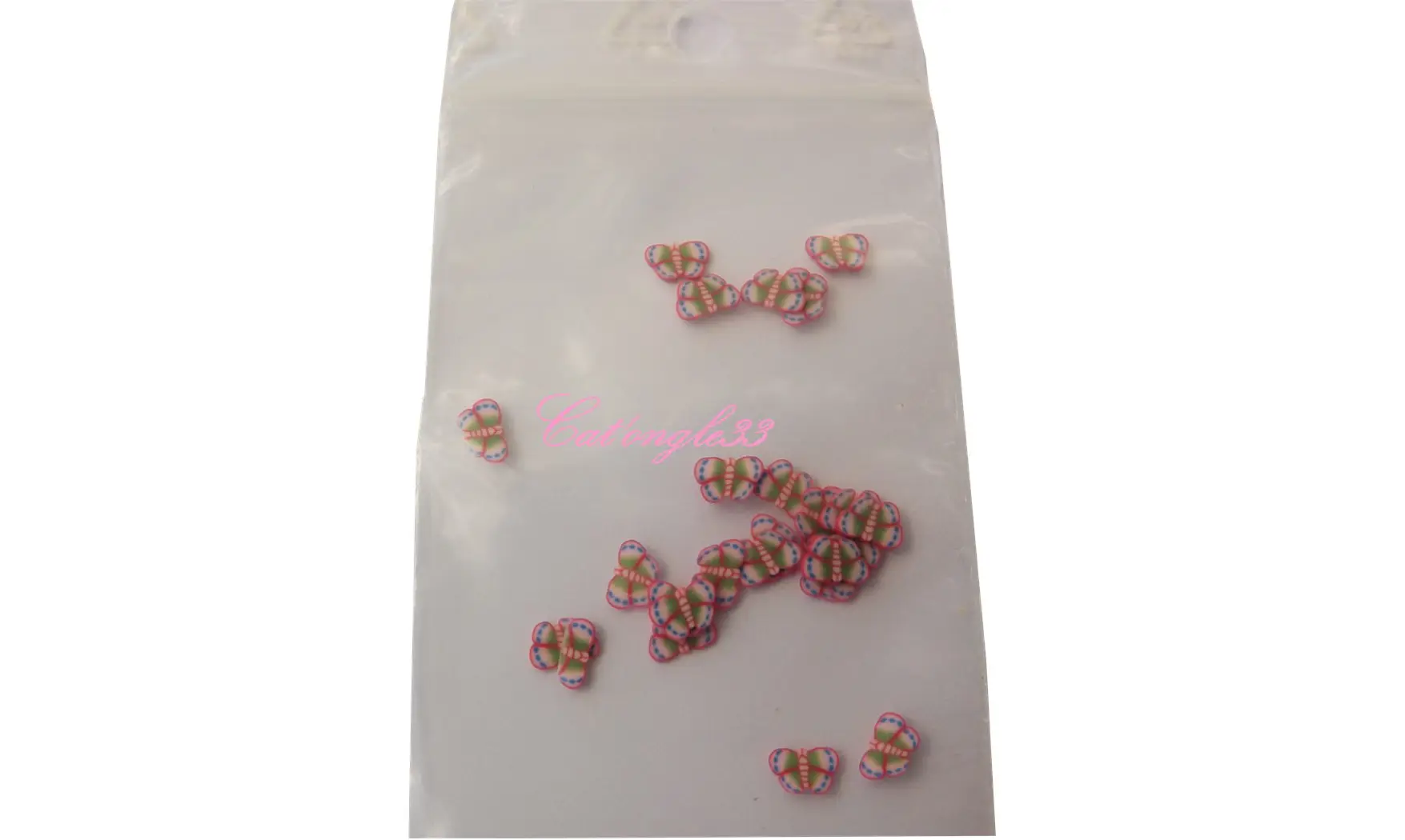 Sachet de fimo papillon rouge bleu vert