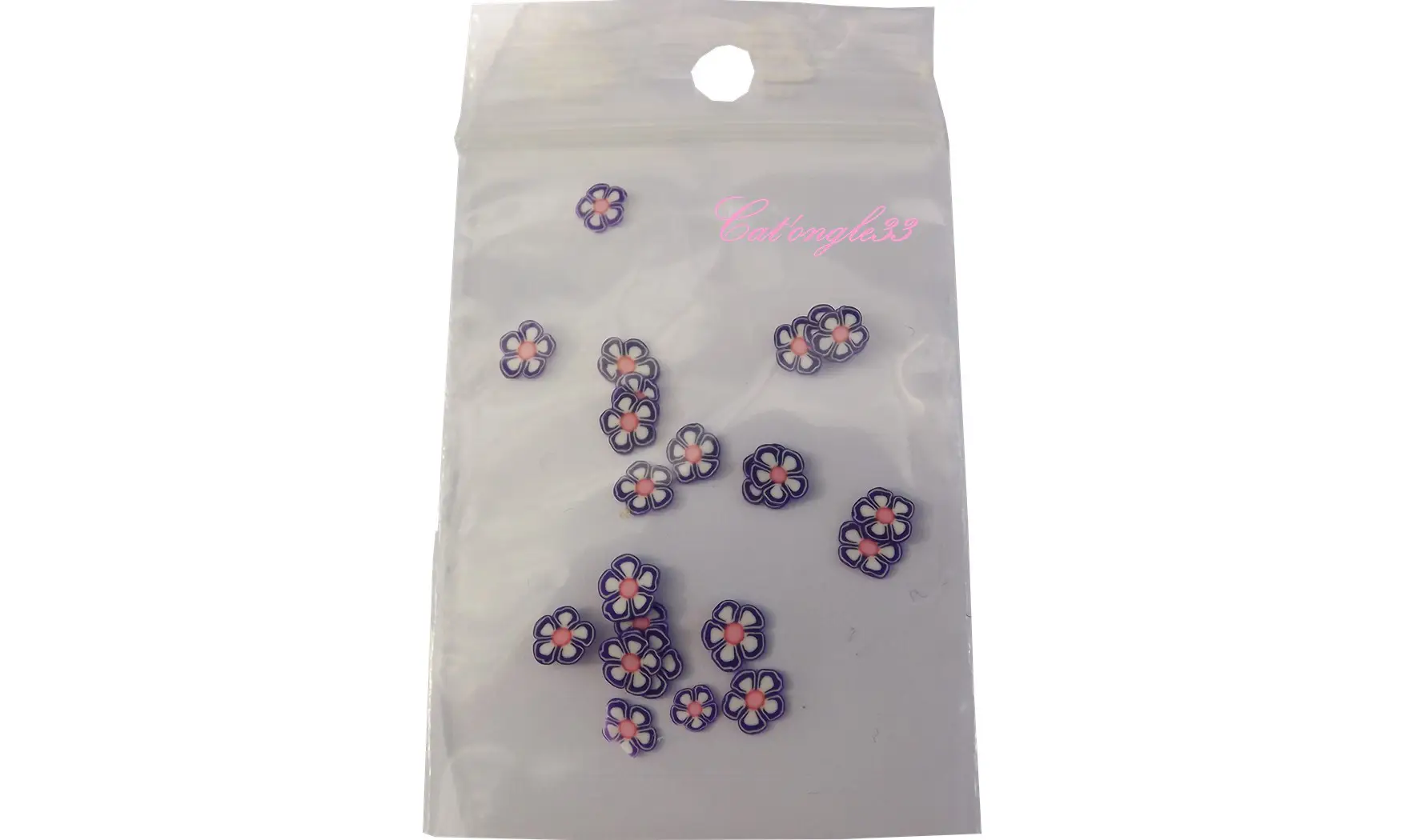 Sachet de fimo fleur violette blanche