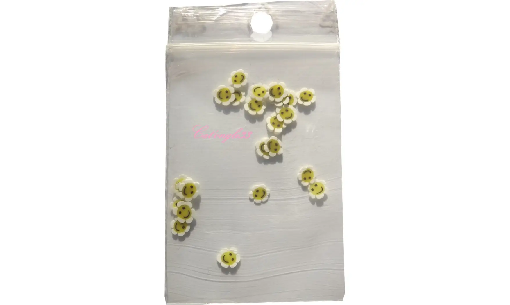 Sachet de fimo smiley fleur blanche